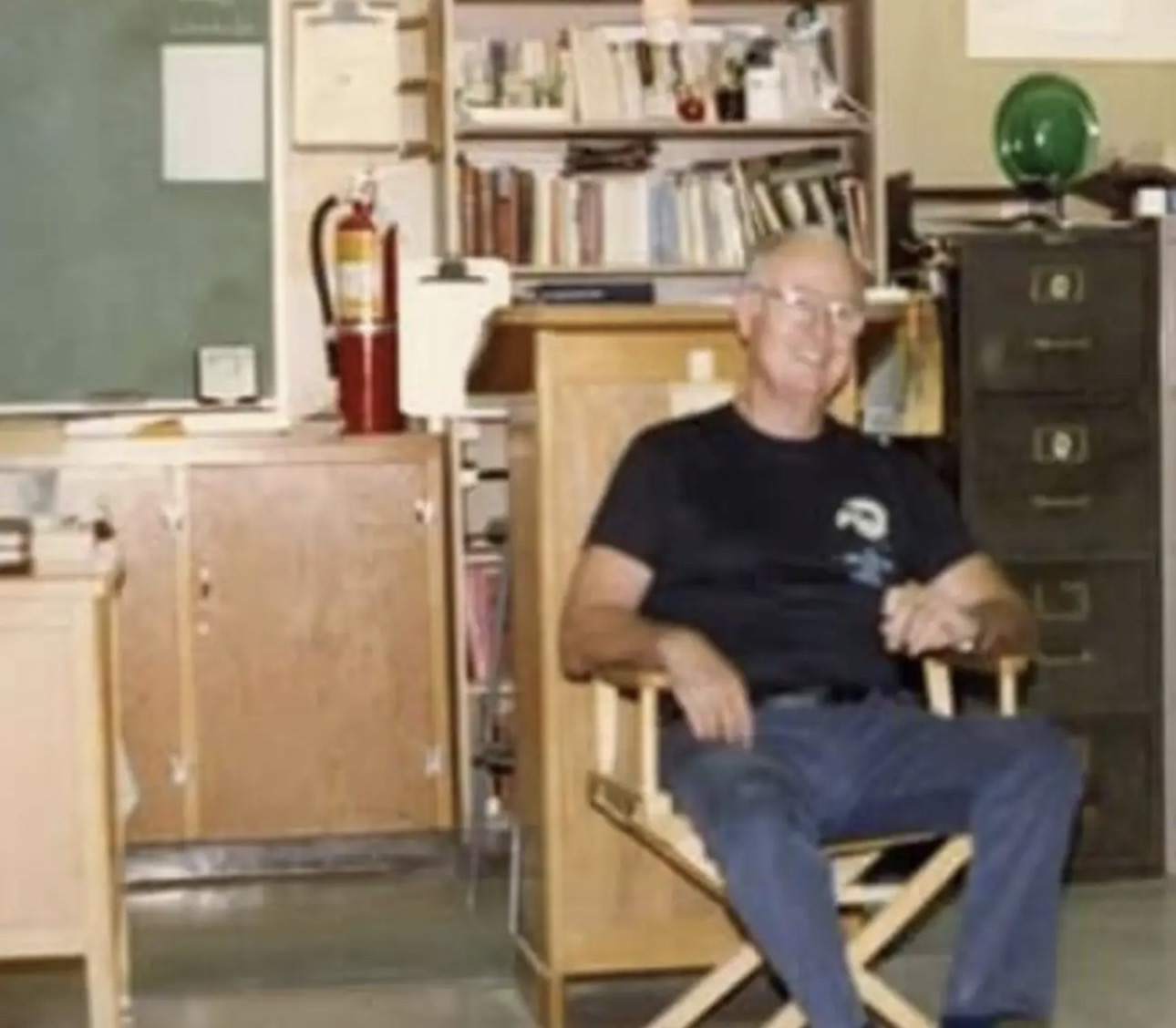 Edward Mulvihill seated in his classroom